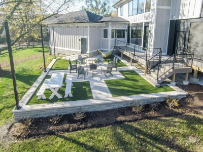 Unique Back Patio Design With Permeable Astroturf Inserts 