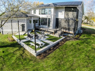 Modern Farm House Eco-Smart Home Rear Elevation Containing Permeable Back Patio, Stacked Screened-In Porches, And 11.52 Solar Array 